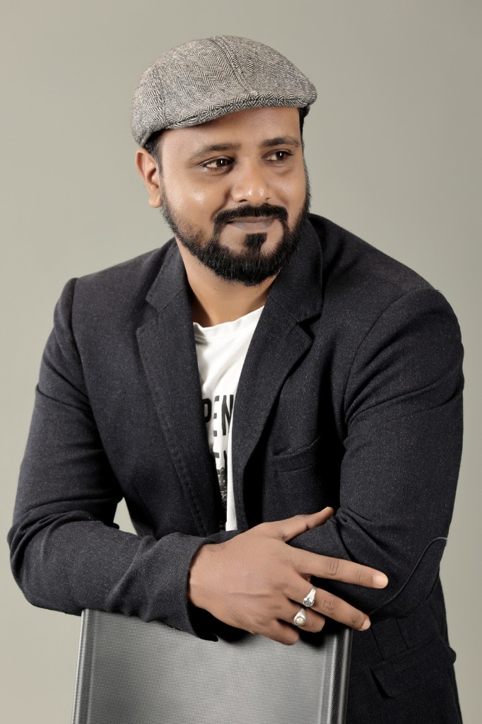 Imamuddin in a thoughtful studio portrait